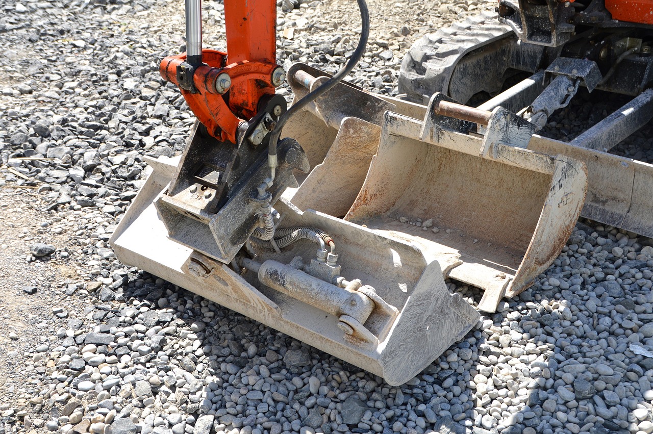 Excavator grading a site in Coeur d'Alene, ID